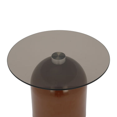 Glass side table with large round top, dark base column, and central finial
