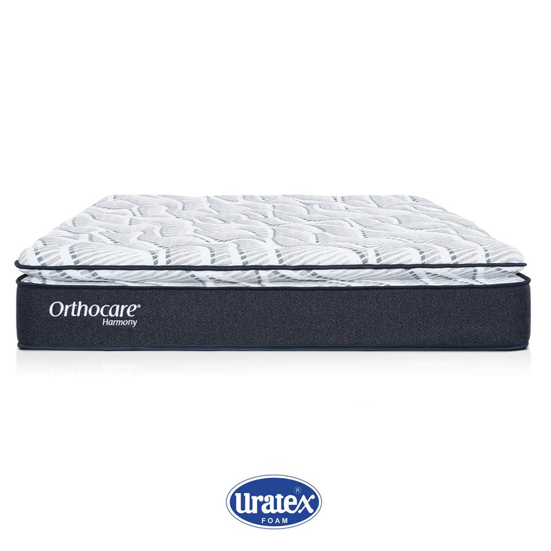 Orthocare Harmony mattress with white quilted top and dark navy foam base