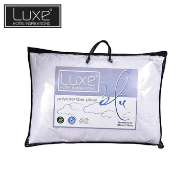 Polyester fiber pillow with black piping, sealed in clear storage bag