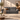Dark gray 4-seater sofa with three seat cushions and two armrests