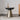 Round black side table with gold pedestal base