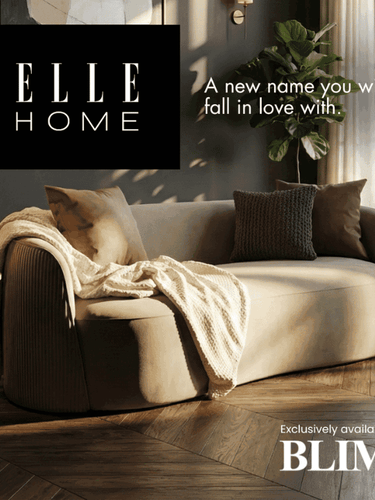 Modern living room with a beige sofa, decorative pillows, and a plant, featuring the Elle Home branding.