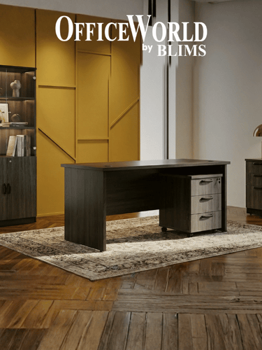 Modern office setup with a desk and bookshelf in a room with wooden flooring and yellow walls.