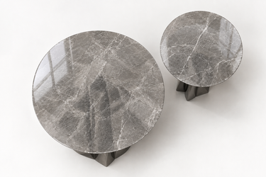 Round grey marble center table top with curved flared metal pedestal legs