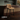 CAMILLA barstool with tan cushioned seat, curved back, and black metal legs with footrest
