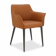 Upholstered dining chair with tan seat and rolled arm design, angled view, dark legs.