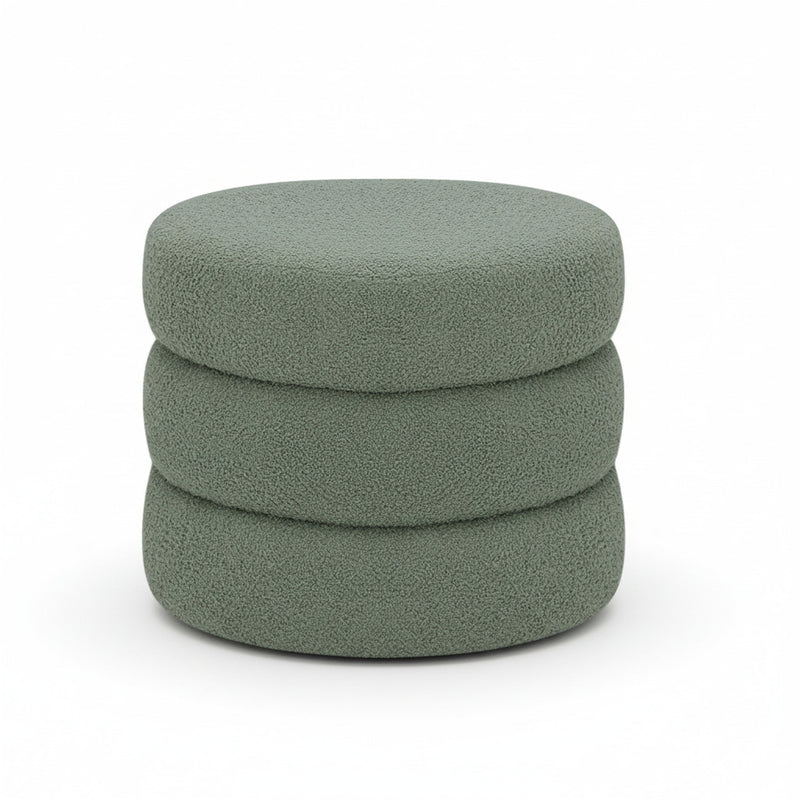 Green round ottoman with two stacked cushion layers, smooth rounded top
