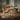Walnut-finish dining table with four upholstered chairs and padded seats
