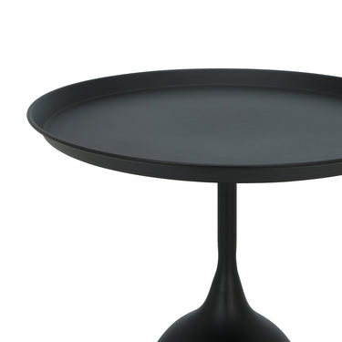 RAVEN side table angled view: round dark tabletop on slim pedestal